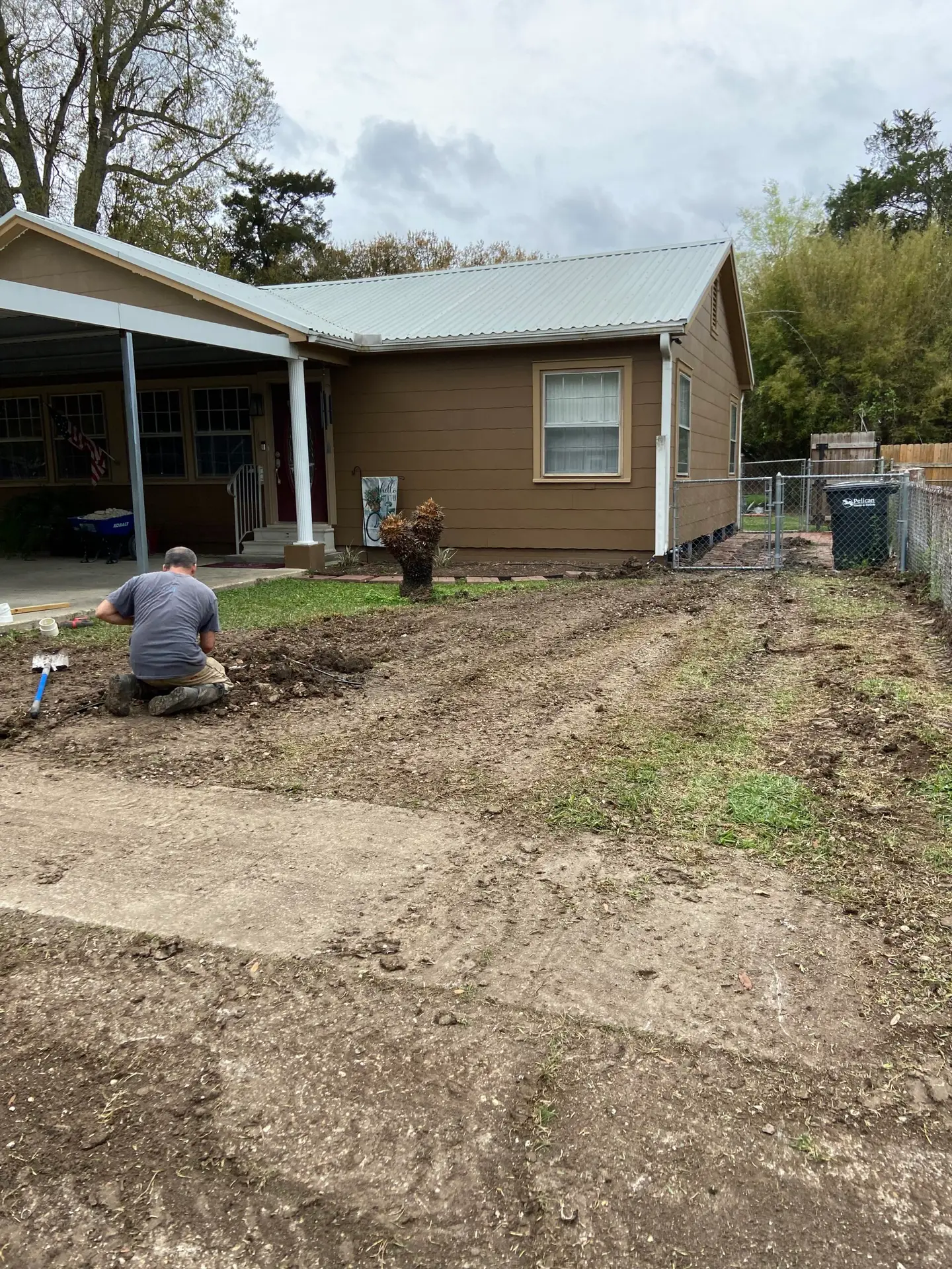 Finished sewer line replacement site with Michael B Plumbing tractor and trailer in New Iberia, Louisiana