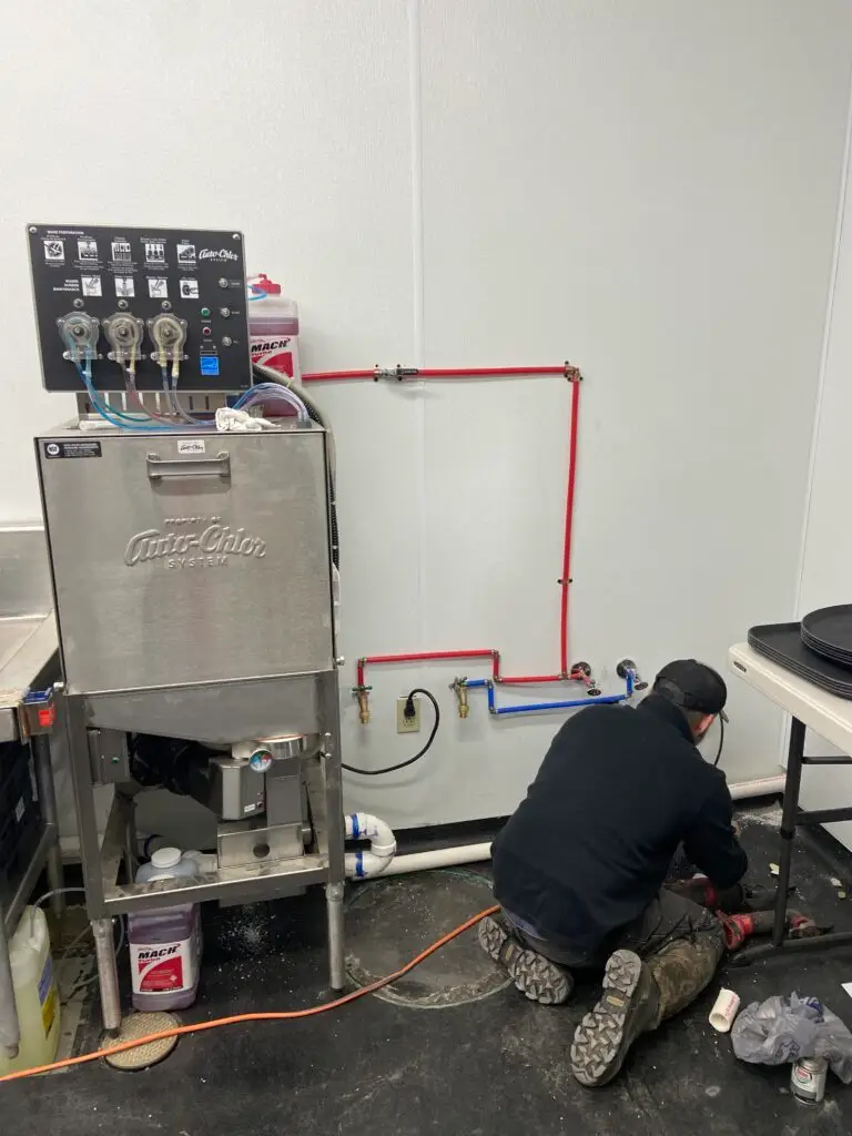 Water lines installed for a commercial dishwasher at Bambino’s Burgers restaurant in New Iberia, Louisiana