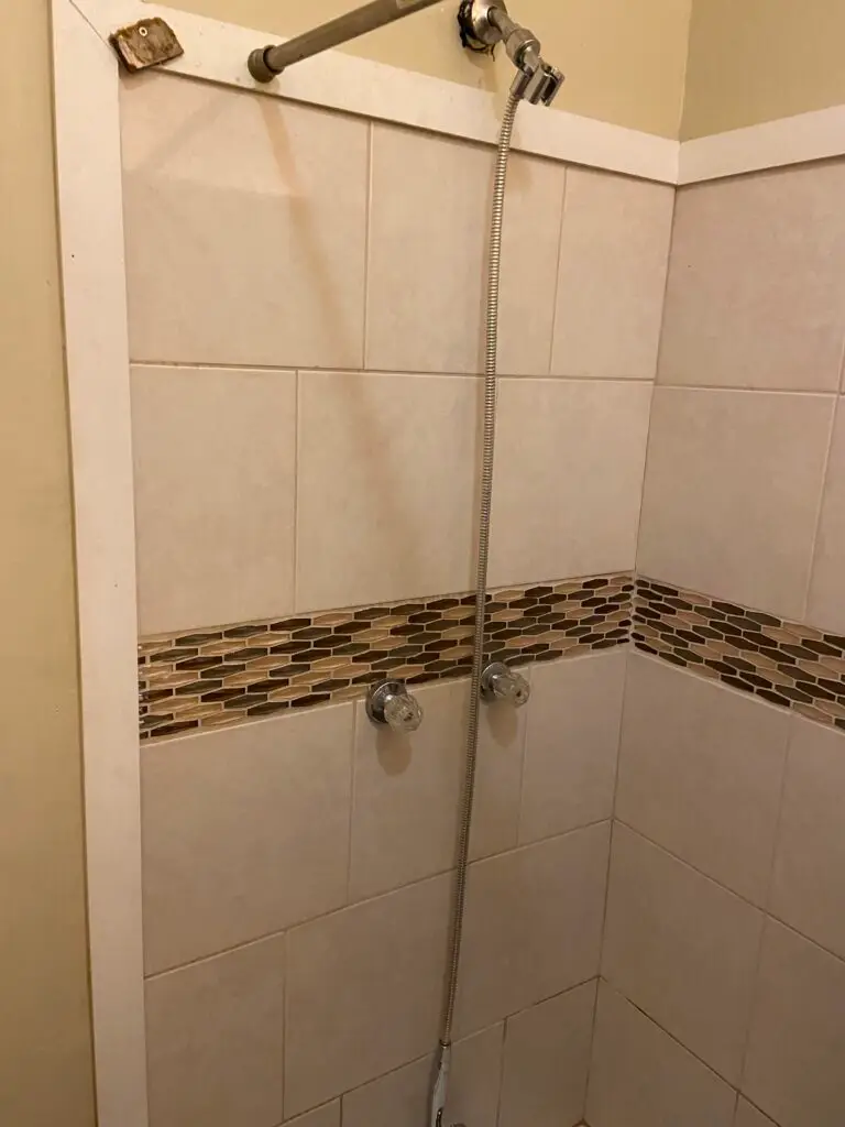 Before photo of a shower faucet replacement in New Iberia, Louisiana
