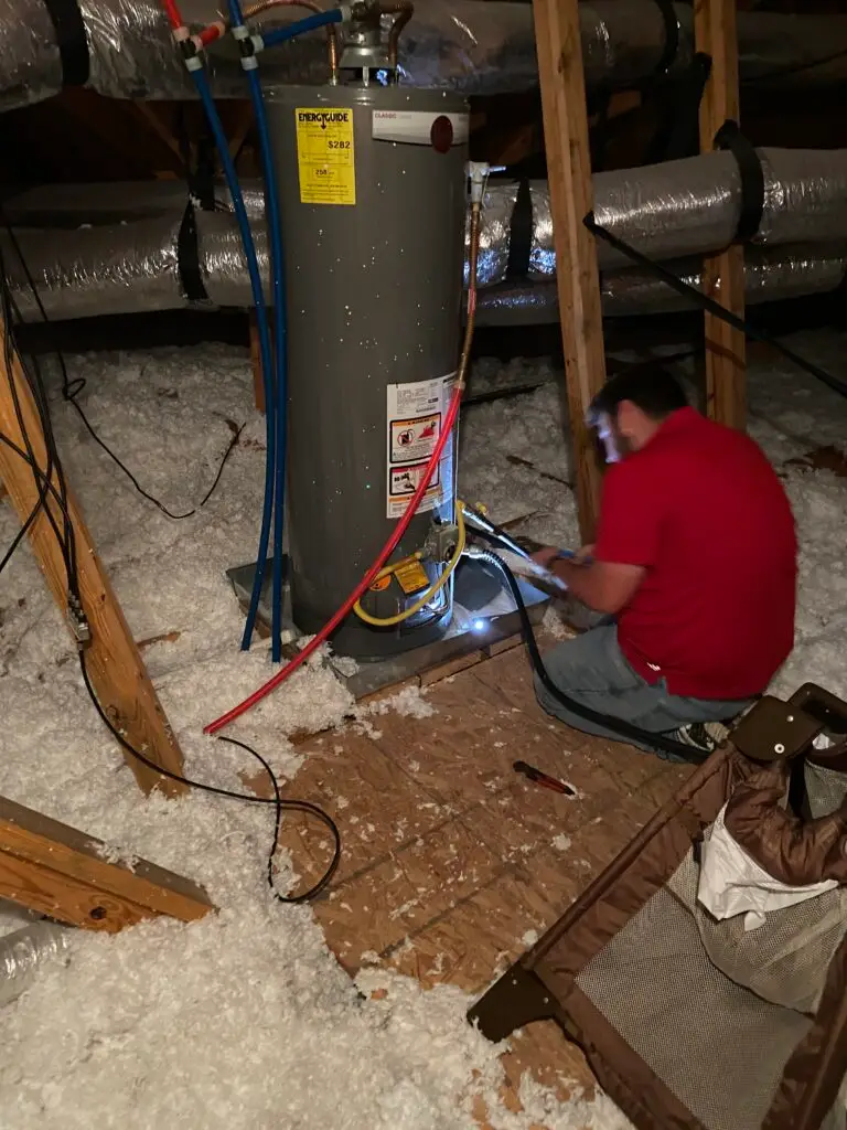 Gas water heater repair in an attic in the Sugar Ridge area of Youngsville, Louisiana