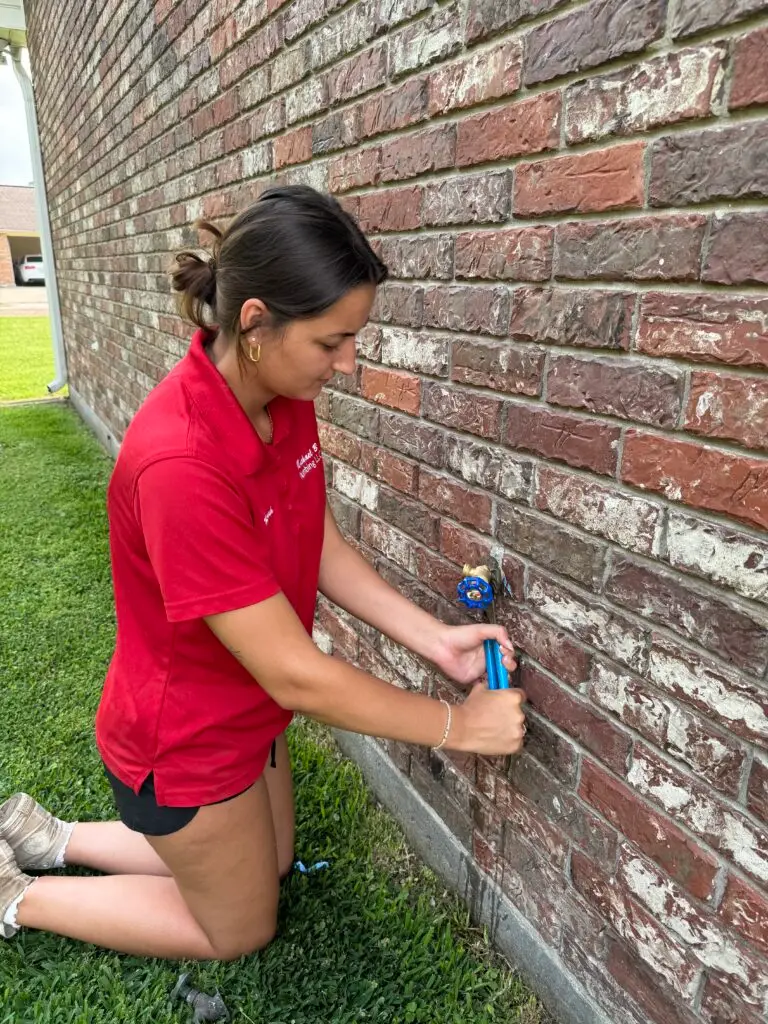 Hannah replacing an outdoor hose bibb for Michael B Plumbing in New Iberia, Louisiana