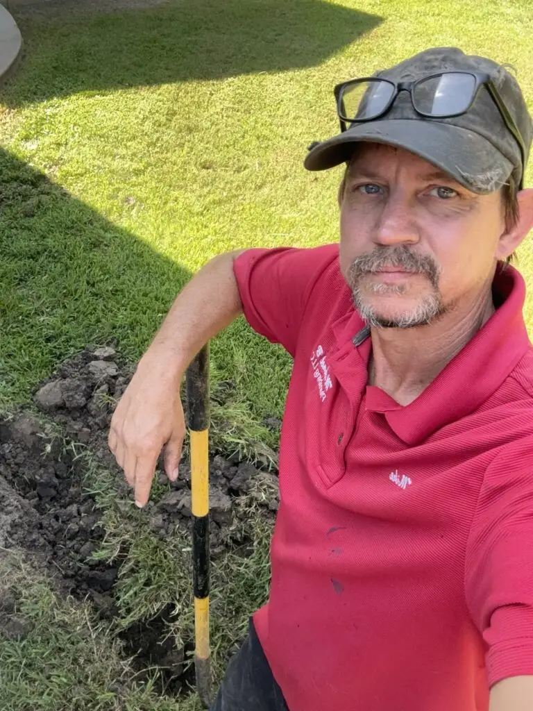 Michael B Plumbing technician working on an underground gas line replacement in Breaux Bridge, Louisiana