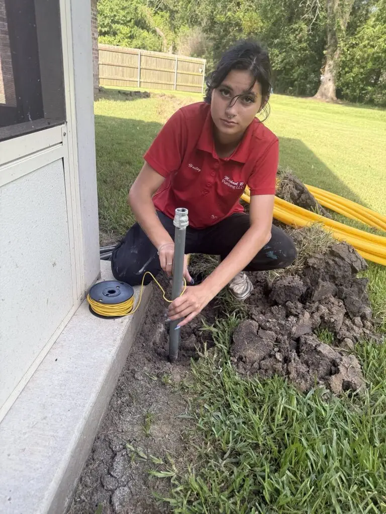 New gas line riser with yellow tracer wire installed beside a Breaux Bridge home