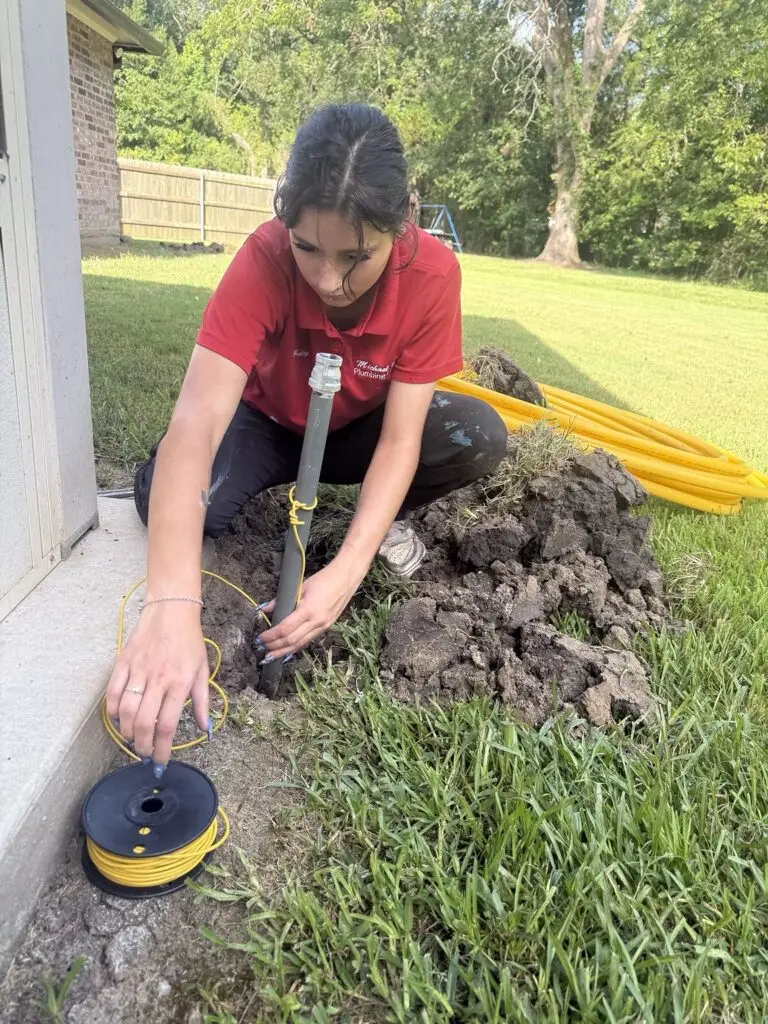 Technician installing tracer wire with a buried gas line in Breaux Bridge, Louisiana