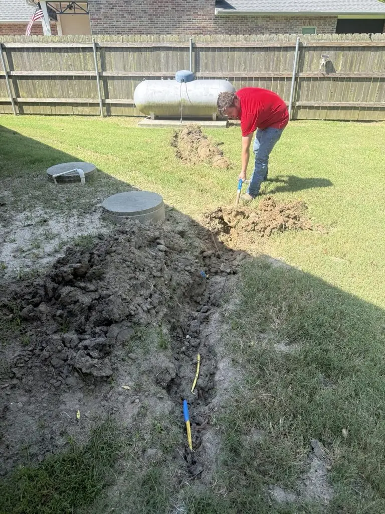 Technician excavating a trench for a replacement gas line in Breaux Bridge, Louisiana