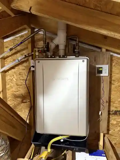 Noritz tankless water heater installation with attic piping and control in New Iberia, Louisiana
