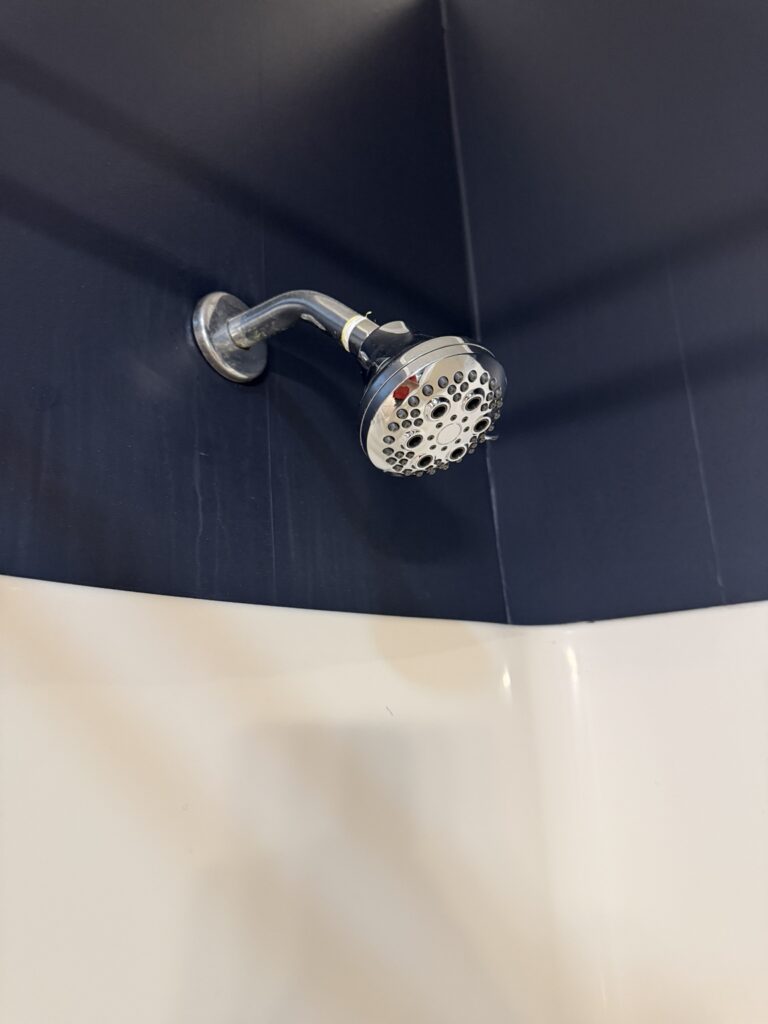 Showerhead tested after completing a single-handle tub and shower faucet conversion in New Iberia